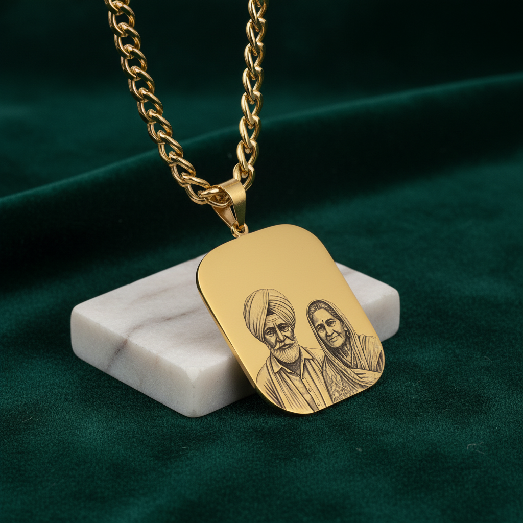 Gold-plated engraved photo necklace, rounded rectangle pendant on a curb chain, with an elderly couple engraving on marble