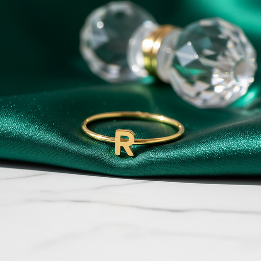 Personalized initial ring, thin gold-tone band with a letter, letter 'R' on velvet with a crystal knob