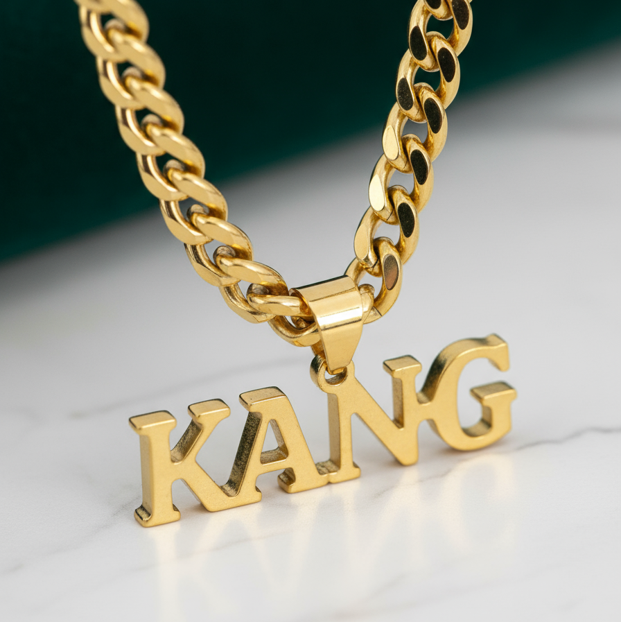 Gold-plated custom name necklace for men on a curb chain, name 'KANG' in English, close-up