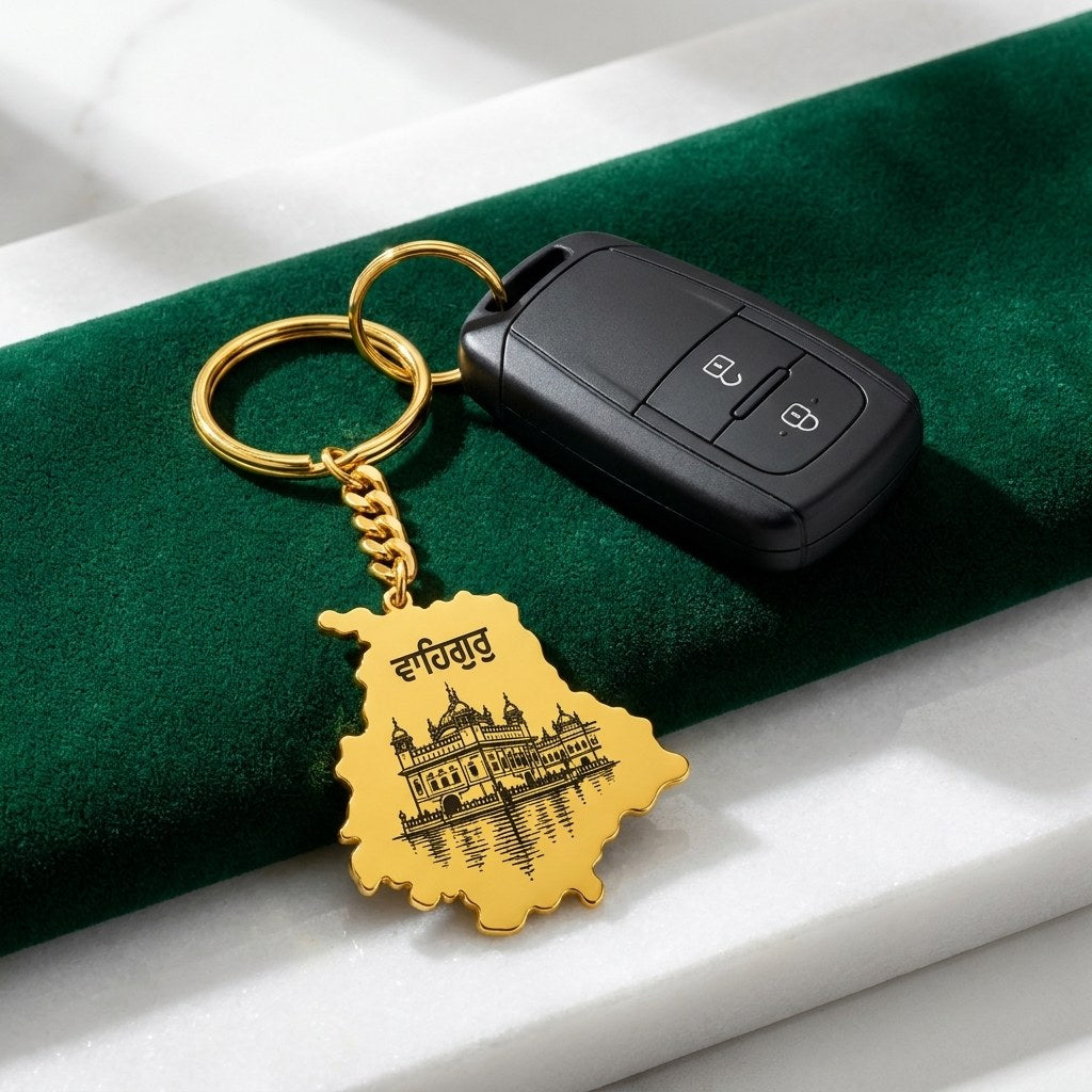 Golden Temple Punjab map keychain with a car key on green velvet