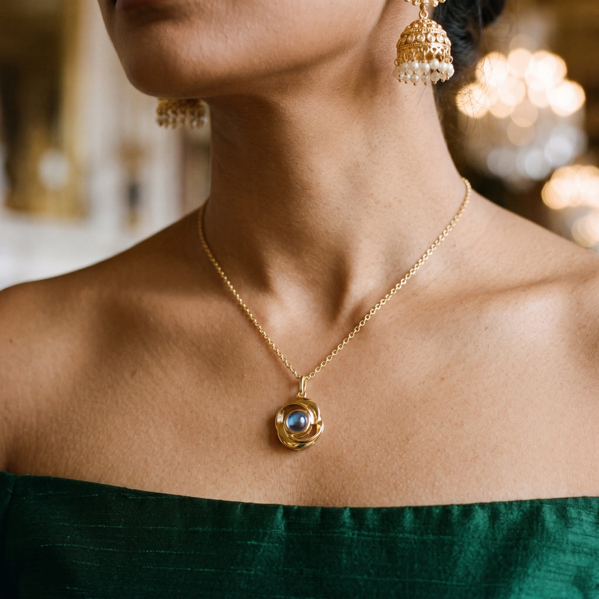 Gold rose projection necklace worn on the neck