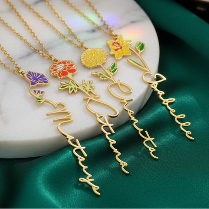 Gold necklaces with floral pendants on a marble surface