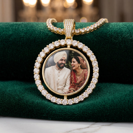 Rotating photo pendant with a wedding couple photo on green velvet